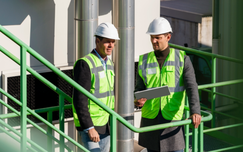 Two safety workers with white helmets